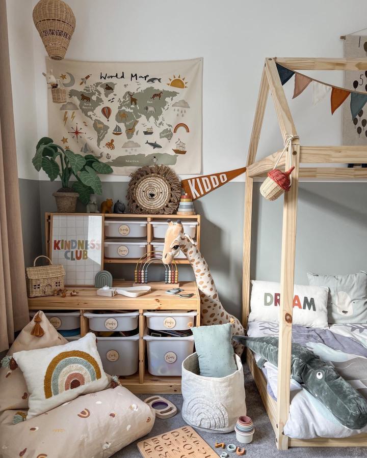 Natural wood and neutral toned Montessori-inspired playroom with IKEA TROFAST storage and cozy soft furnishings from @brionys.home playful and organized kids space.