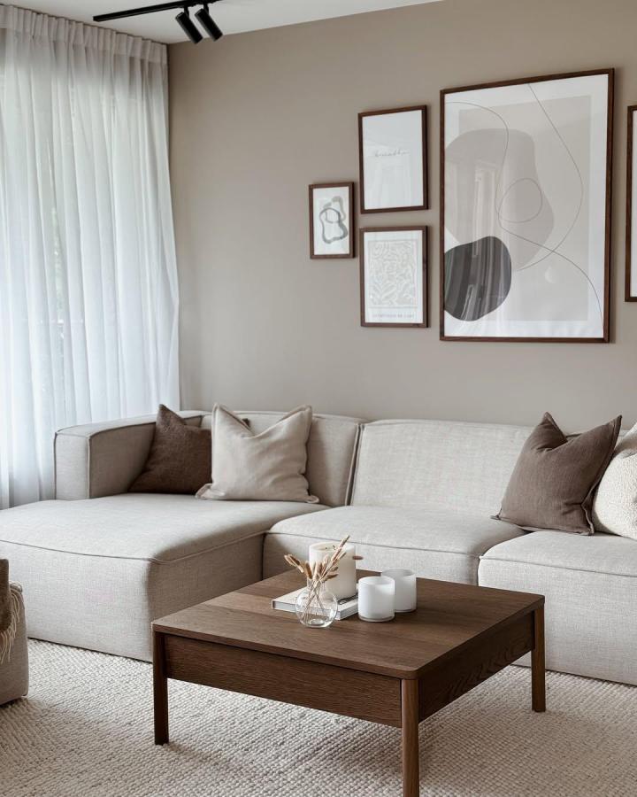 Dark oak toned IKEA TONSTAD table in a beige minimalist living room by @heidi.interior showing ikea pottery barn dupes style.