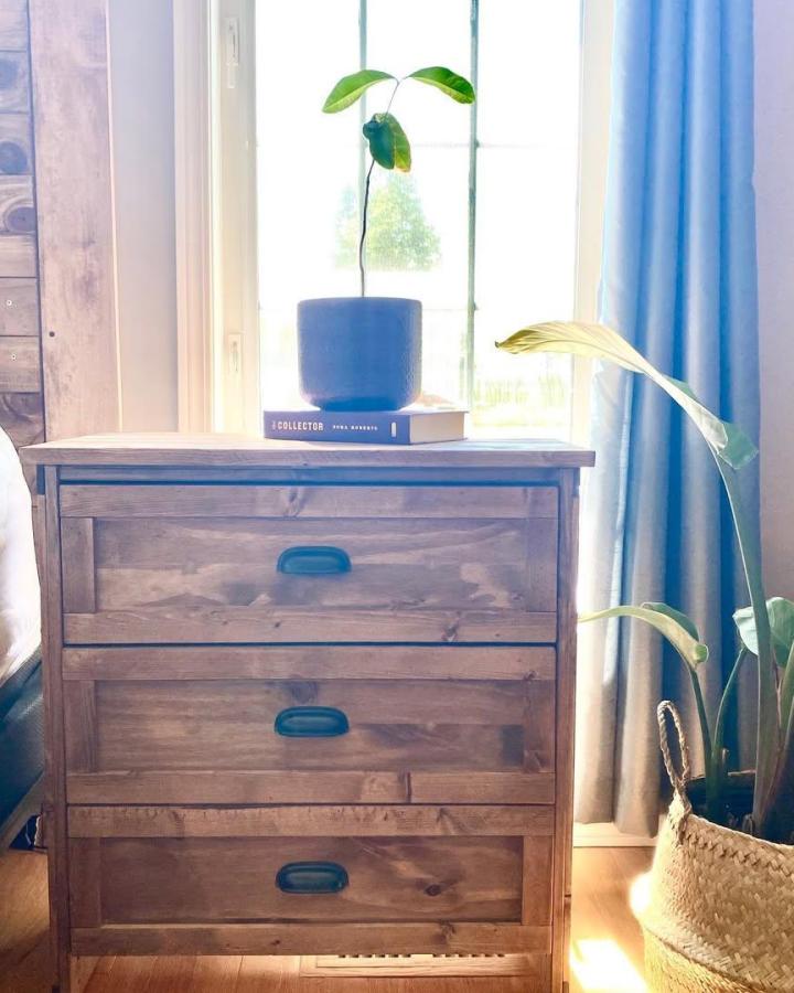 Rustic wooden Ikea RAST dresser upcycled by @christal_linfitt with black cup pulls, an ikea pottery barn dupes classic look.
