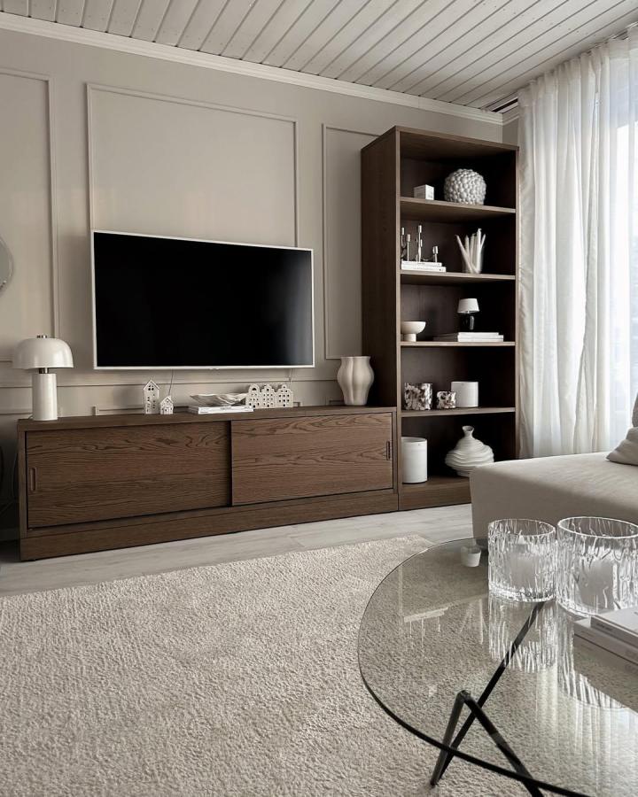 Dark oak stained Ikea TONSTAD TV unit and bookshelf from @sallashouse styled as ikea pottery barn dupes with minimalist decor.