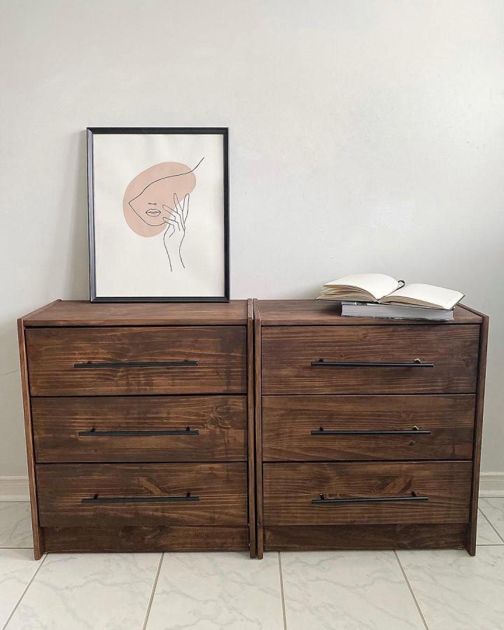 Dark stained wooden Ikea Rast drawers with black handles from @the.painted.sisters showing elegant rustic chic storage upgrade.