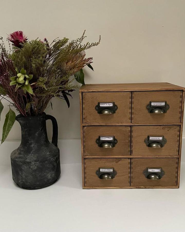 Rustic wooden Ikea MOPPE tea drawer repurposed by @the_little_hinton_house with vintage brass handles ikea pottery barn dupes.