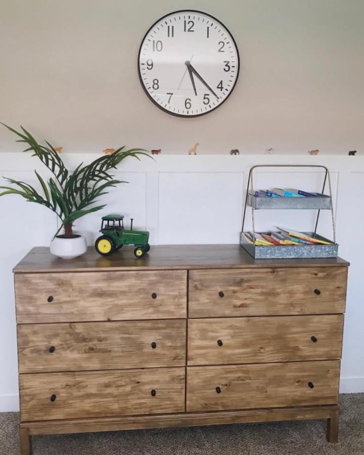 Light stained wood dresser with black knobs and rustic finish from @triedandtruemoms. Ikea hacked for high end look.