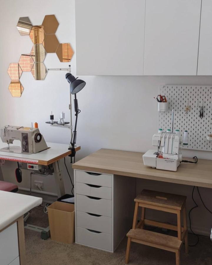White and oak sewing workspace with IKEA Kallax and Alex drawers from @thatissewjulia. Organized and minimal craft setup.