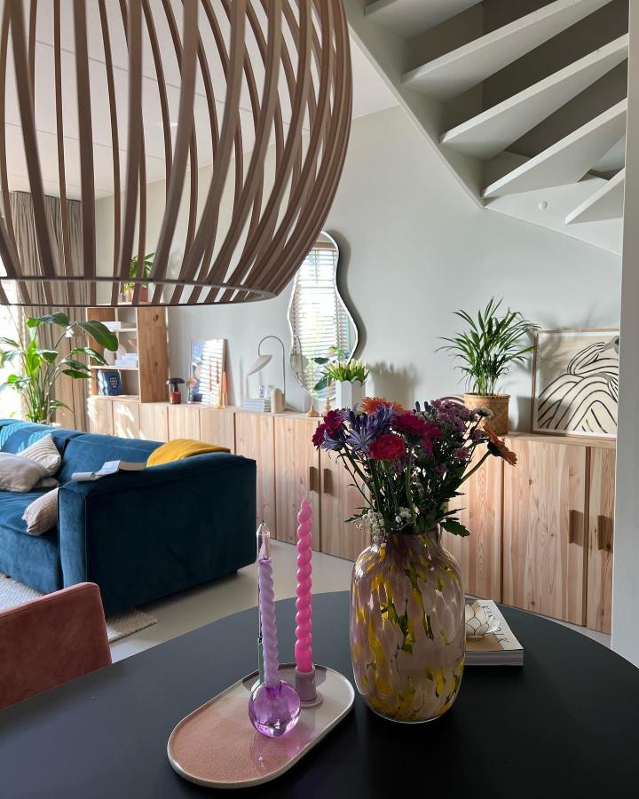 Natural pine IKEA Ivar cabinet in living room by @huisjekwartshove with plants and soft décor maximizing compact space.