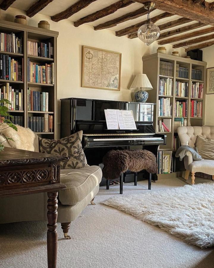 Muted Green Billy Bookcases Living Room by @myoldpub with rustic beams and cozy layered textures for compact spaces.