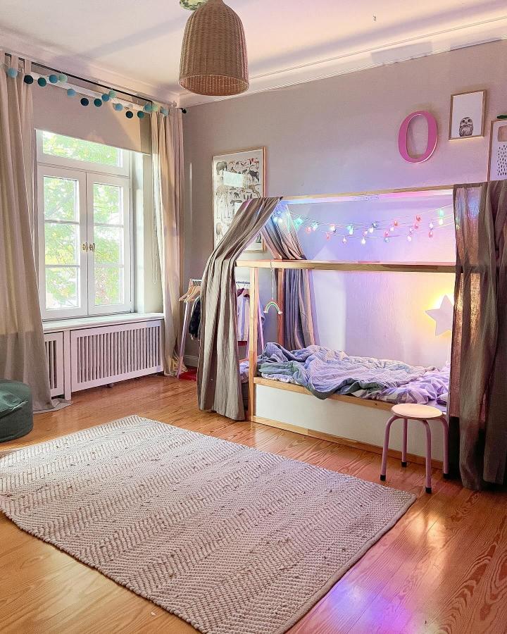 Natural wood and lavender KURA bed from @kuralove.de. Best accessories for ikea kura beds with curtains and fairy lights.
