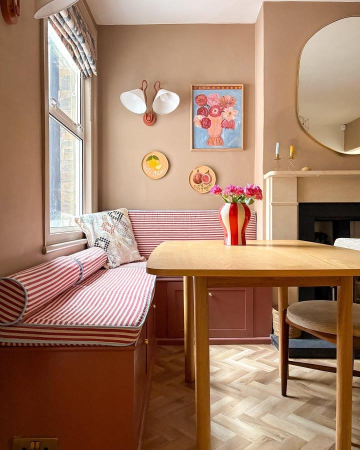 Warm Taupe Dining Nook from @_itstartedwithacushion. Fresh ikea besta built in ideas with striped cushions.