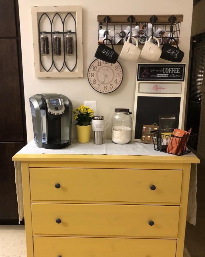Yellow HEMNES coffee station from @t_rishg. Wall rack holds mugs above a cheerful dresser.
