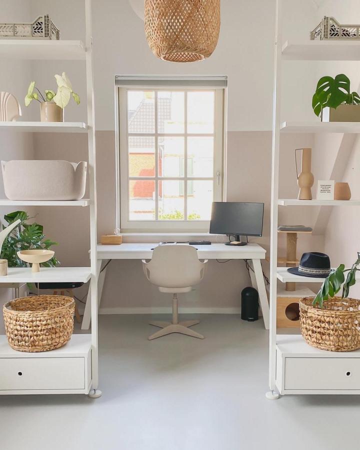 White Elvarli home office from @achterderozevoordeur. ikea elvarli room divider ideas with rattan baskets and plants