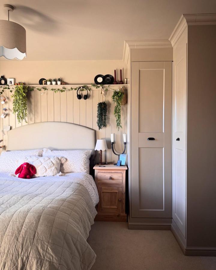 Warm beige small bedroom from @mabelinthehouse featuring ikea pax small bedroom ideas. Paneled wardrobes and cozy bedding.