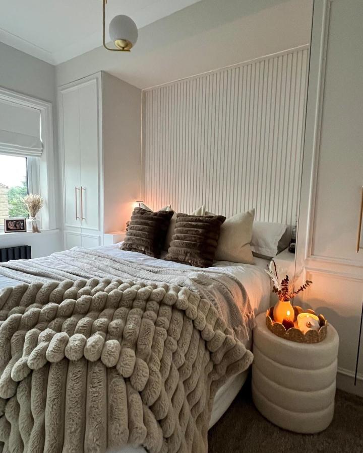 Soft gray fluted bedroom from @making_a_home_. Cozy ikea pax small bedroom ideas with white wardrobes and textured bedding.