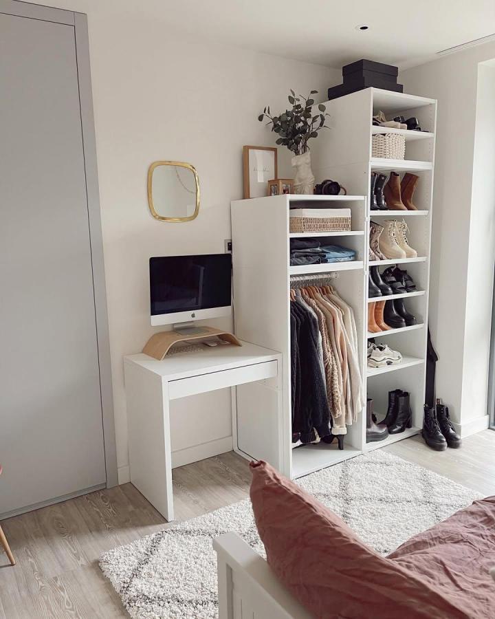 White open wardrobe from @newbuild.renewed. PLATSA storage features shoe shelves, hanging rails, baskets, and a compact desk.