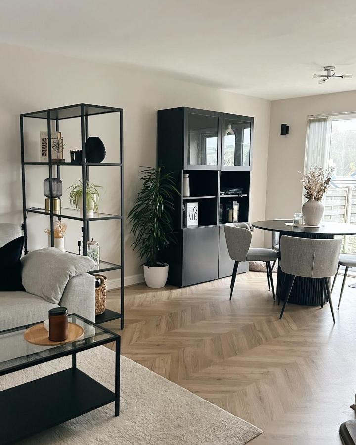 Black open shelving from @aliciajanehome. ikea room divider ideas for small spaces separate living and dining areas.