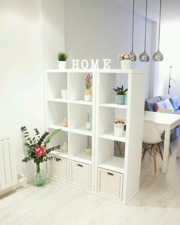 White KALLAX shelving divider from @inspirasirumahcantik. Separates dining and living areas in a bright small home.