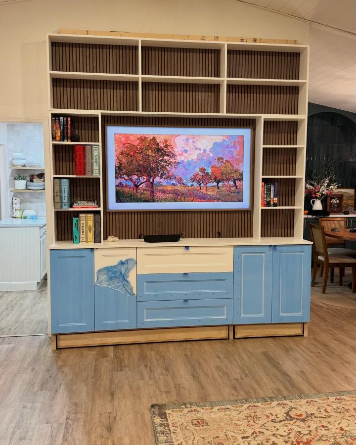Blue-and-cream built-in IKEA storage divider from @delancey.diy. IKEA room divider ideas for small spaces with wood slats.