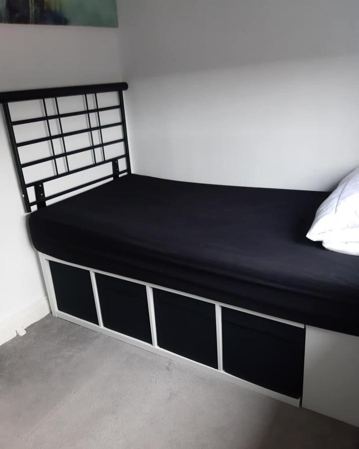 Black IKEA KALLAX diy bed from @thesmith_home. ikea small bedroom hacks with hidden storage.