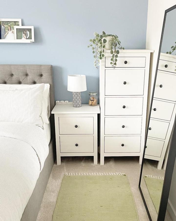 White HEMNES bedroom furniture from @mrandmrsjhbhome_xx. Compact storage beside a grey bed.