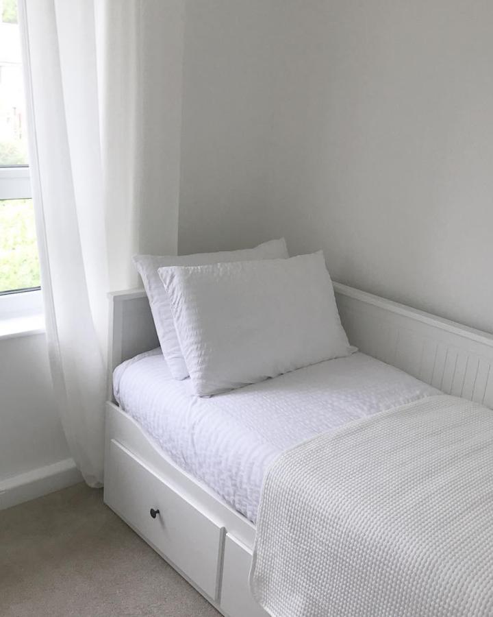 White HEMNES daybed from @homesweetnumber4. Compact bedroom storage with drawers, white bedding, and a soft textured throw.