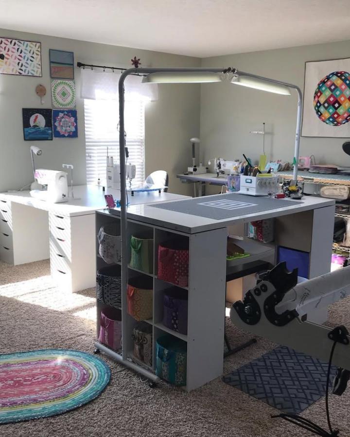 Gray modular craft room from @florajeans. This ikea small craft room ideas setup features colorful fabric bins and bright task lighting.
