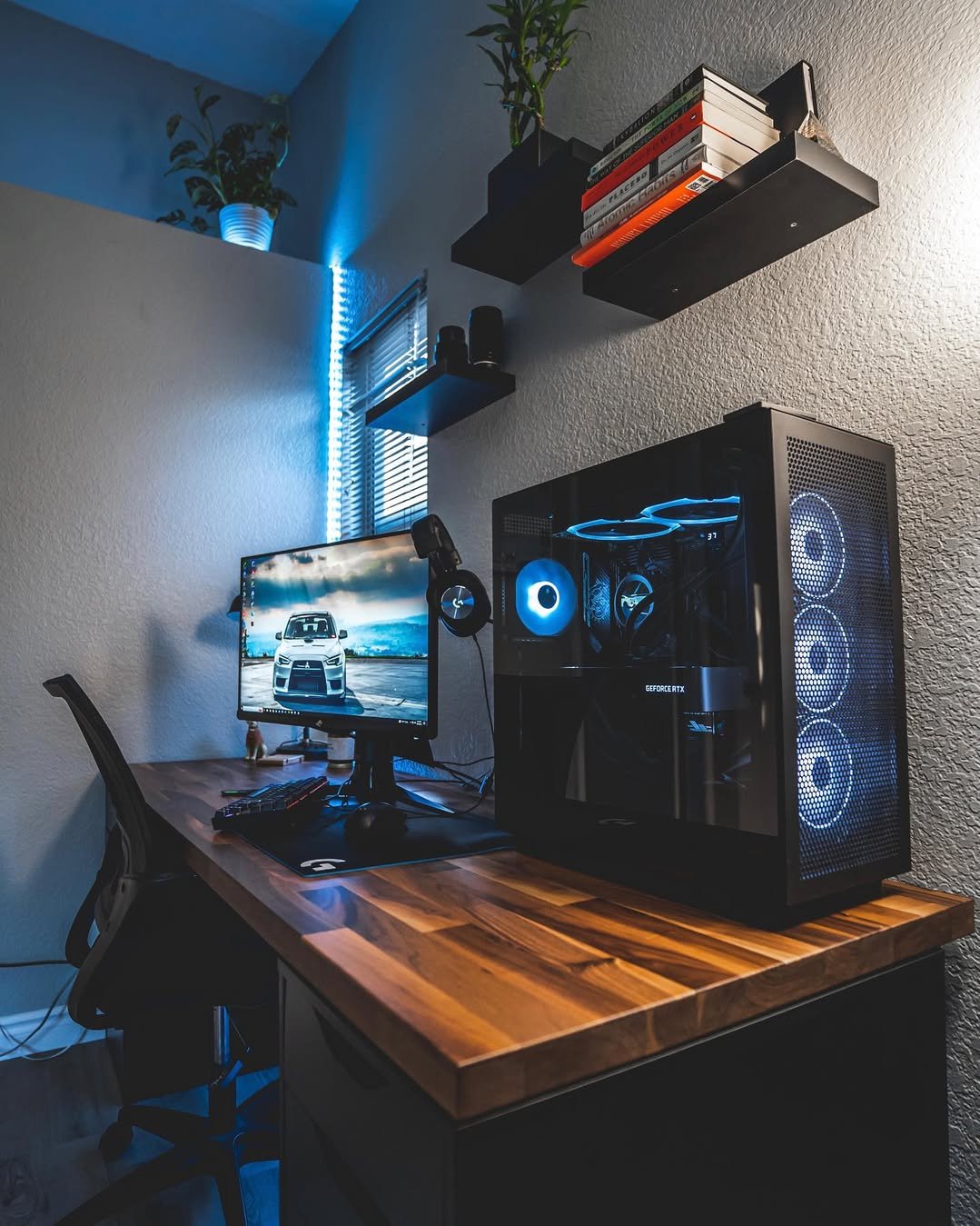 best desktops for ikea alex desks featuring an IKEA KARLBY top, black drawers, and blue-lit gaming setup
