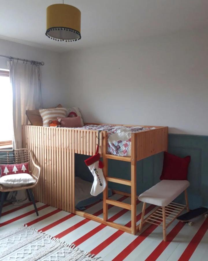 Natural wood IKEA KURA bed from @canidiyit. ikea kura bed ideas for boys feature slatted privacy panel