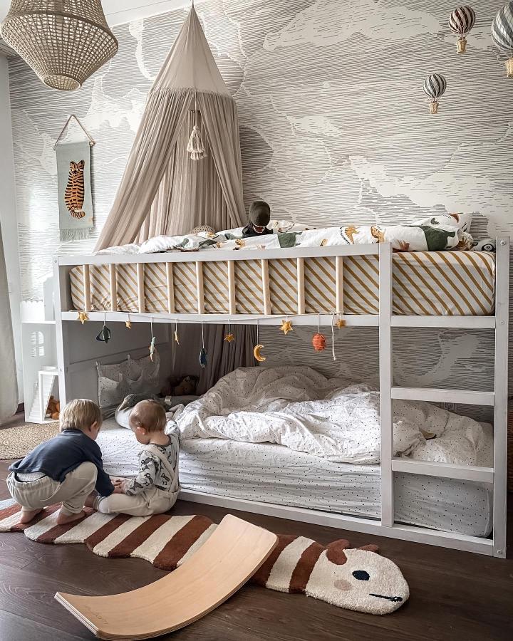 White Canopy Bunk Bed from @ena.maria.b. Cosy layered sleeping nook with stars, striped panels, and playful decor.