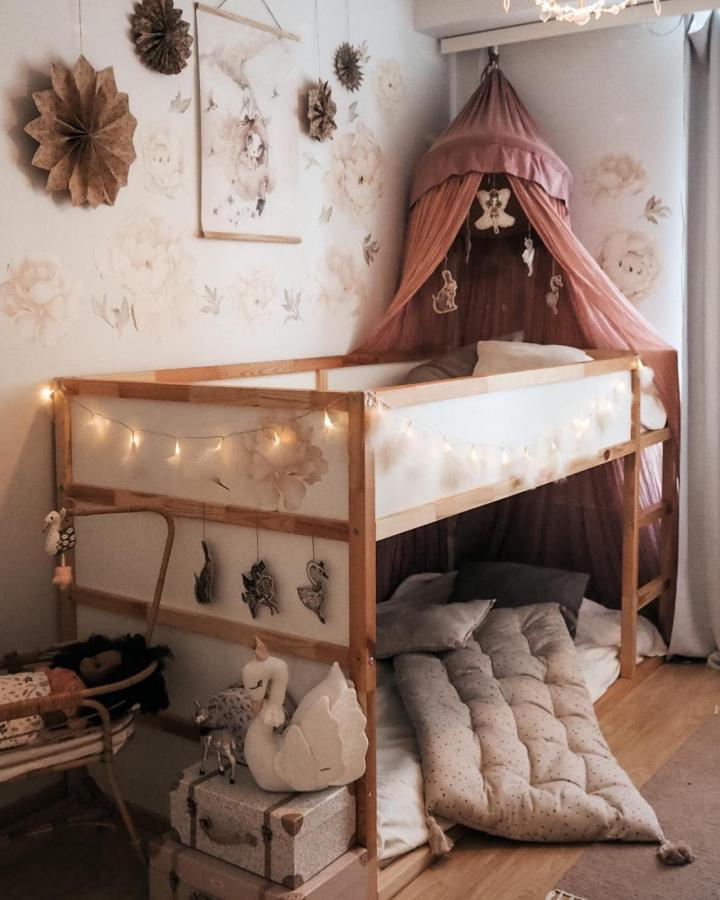 Blush canopy Kura loft bed from @ferdanifamily. ikea kura bed ideas for shared rooms with fairy lights.