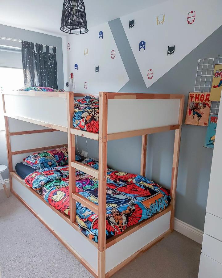 Natural wood superhero bunk bed from @i.am.joling.nunn. Shared-room KURA setup with white privacy panels.