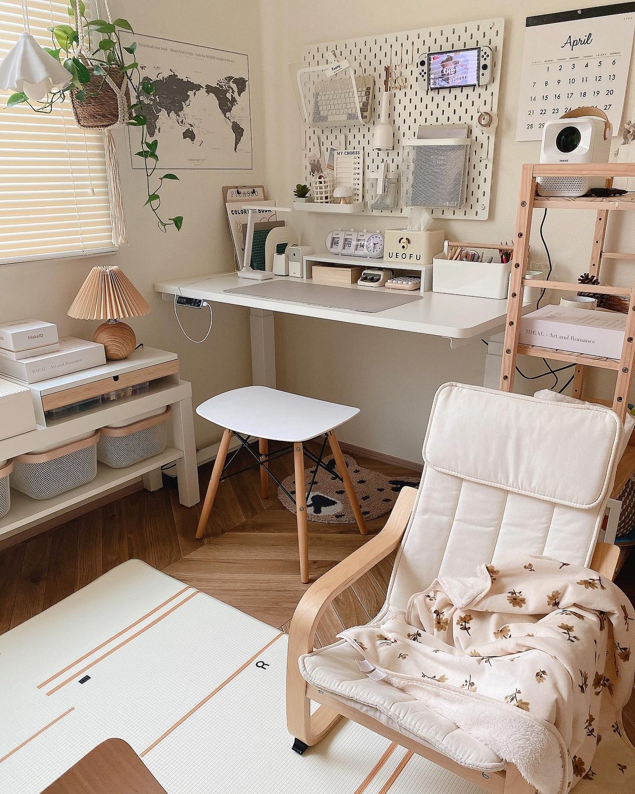 White SKÅDIS pegboard with labeled baskets and organized craft supplies above a bright desk